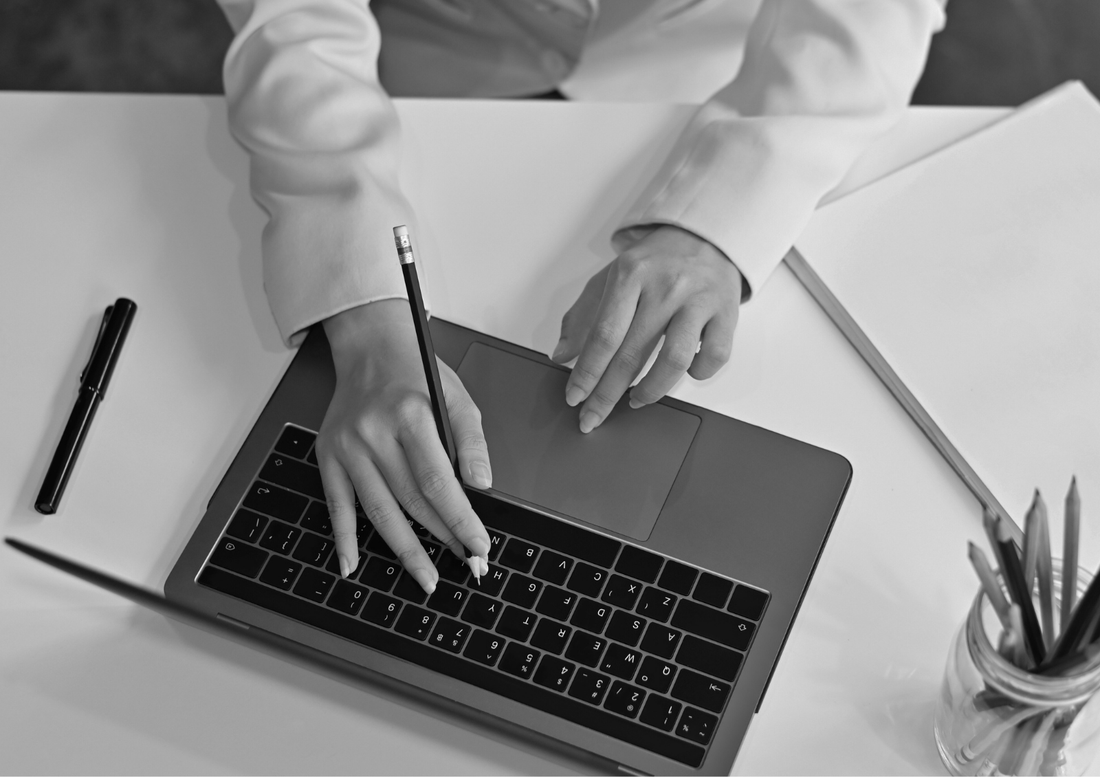 Website optimisation expert reviewing site performance and user experience on a laptop